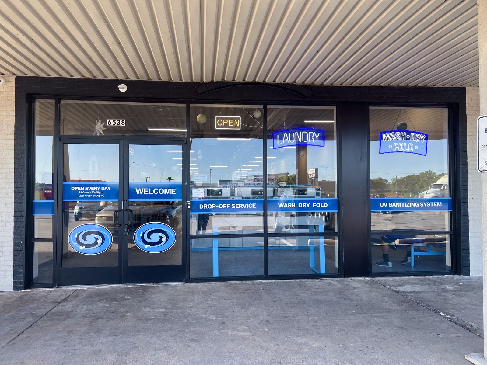 Our Fort Worth storefront entrance with UV sanitizing system signage